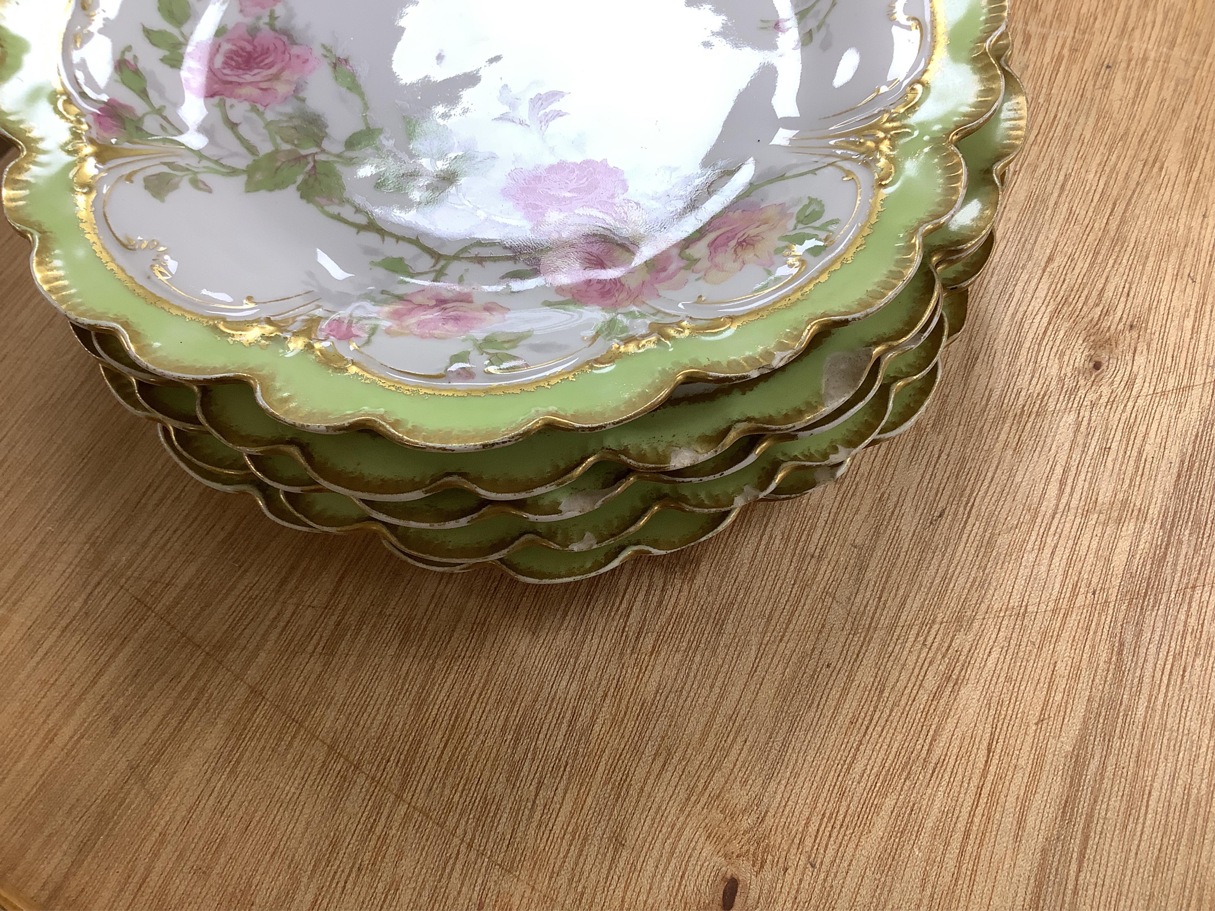 A French porcelain part dessert service together with a set of four Aynsley cups and saucers, the cups with silver holders. Condition - varies, some repairs